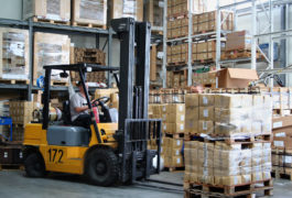 Busy warehouse with pallet trucks working