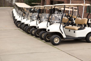 Photo of golf carts parked next to each other